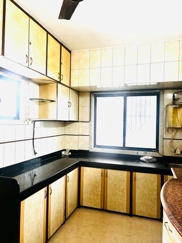 Kitchen in 2 BHK Apartment at Manisha CHS Mulund, Mulund East – for Sale