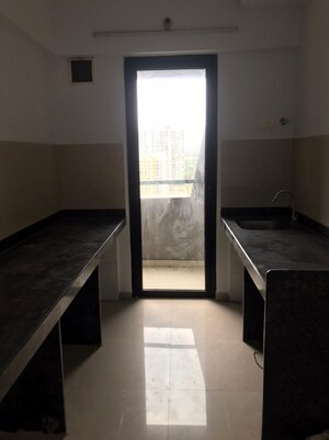 Kitchen in 1 BHK Apartment at Lodha Palava Downtown, Dombivli East – for Sale