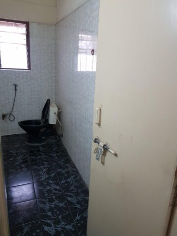 Bathroom in 2 BHK Apartment at Kusum Kunj, Prabhat Road – for Rent