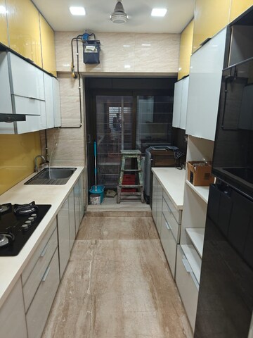 Kitchen in 4 BHK Apartment at DLH Sorrento, Veera Desai Road – for Rent