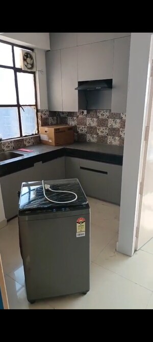 Kitchen in 2 BHK Apartment at AHIP Signature, Sector 18 – for Rent