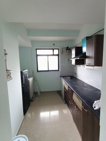 Kitchen in 1 BHK Apartment at Metropolis Rivera, Kasarvadavali – for Rent