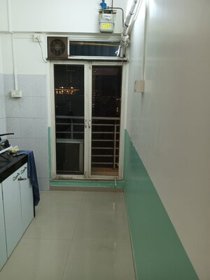 Kitchen in 1 BHK Apartment at Bhageshwar Bhuvan, Mahim – for Sale