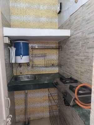 Kitchen in 1 RK Villa at RWA Apartments Sector 26, Sector 26 – for Rent