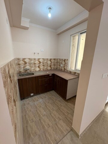 Kitchen in 2 BHK Apartment at Amrapali Golf Homes, Sector 4 Greater Noida – for Sale