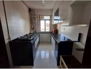 Kitchen in 2 BHK Apartment at Cosmos Classique, Ghodbunder Road – for Sale
