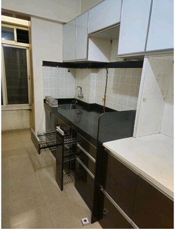 Kitchen in 1 BHK Apartment at Mahavir Kalpavruksha, Ghodbunder Road – for Rent