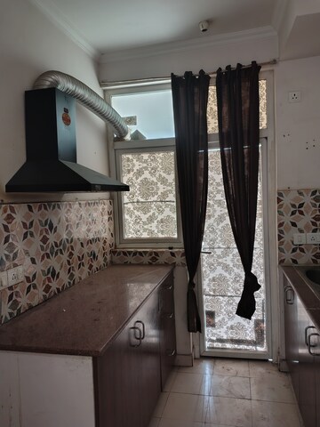 Kitchen in 2 BHK Apartment at Amrapali Leisure Park, Amrapali Leisure Valley – for Rent