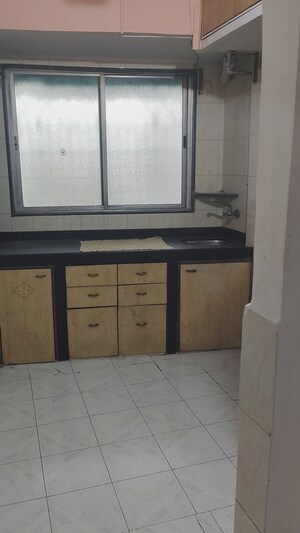 Kitchen in 2 BHK Apartment at Kopar Khairane Sector 19 – for Rent