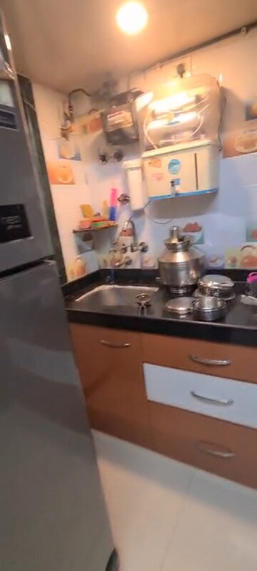 Kitchen in 1 BHK Apartment at Shantinagar CHS, Mira Road – for Rent