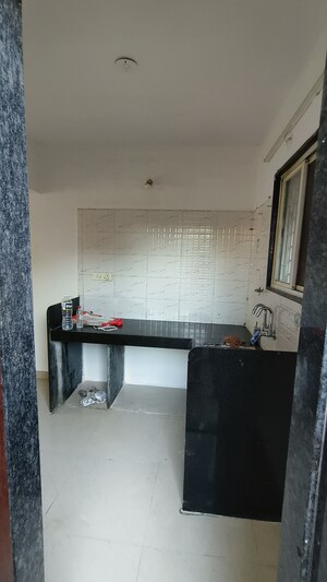 Kitchen in 2 BHK Apartment at Wadgaon Sheri – for Rent