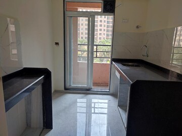 Kitchen in 1 BHK Apartment at Metropolis Rivera, Kasarvadavali – for Rent
