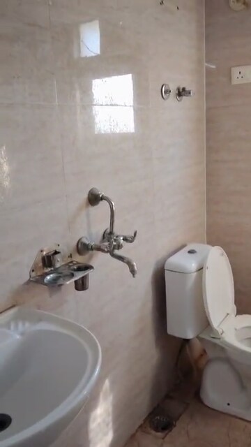 Bathroom in 2.5 BHK Apartment at Raj Nagar Extension – for Sale