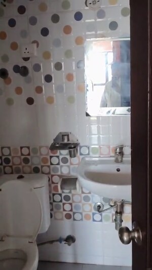 Bathroom in 2.5 BHK Apartment at Raj Nagar Extension – for Sale