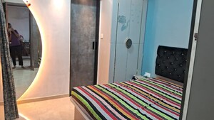 Bedroom in 2 BHK Apartment at Triumph Omkareshwar CHS, Borivali East – for Sale