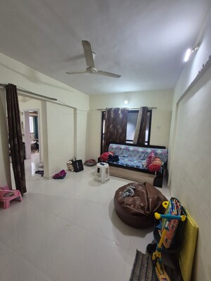 Living Room in 2 BHK Apartment at Shivane – for Sale