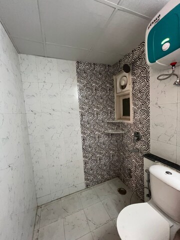 Bathroom in 3 BHK Apartment at Cosmos Express 99, Sector 99 – for Rent