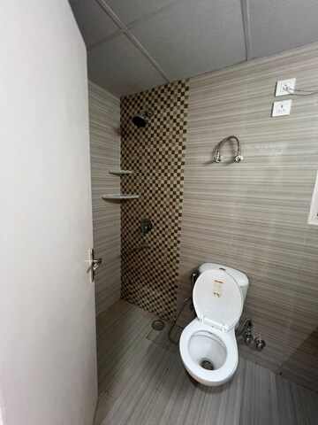 Bathroom in 3 BHK Apartment at Cosmos Express 99, Sector 99 – for Rent