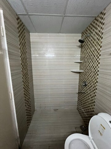 Bathroom in 3 BHK Apartment at Cosmos Express 99, Sector 99 – for Rent