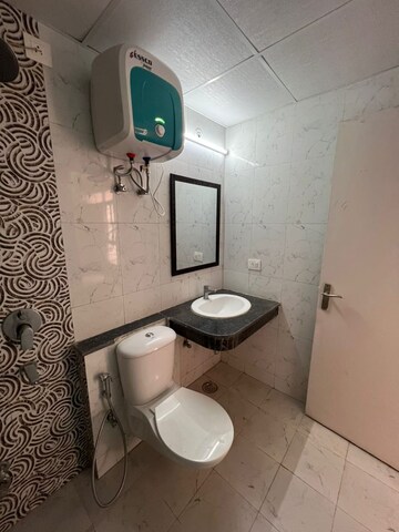 Bathroom in 3 BHK Apartment at Cosmos Express 99, Sector 99 – for Rent