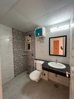 Bathroom in 3 BHK Apartment at Cosmos Express 99, Sector 99 – for Rent