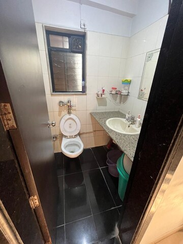 Bathroom in 1 BHK Apartment at Gokul Nagari CHS, Kandivali West – for Sale