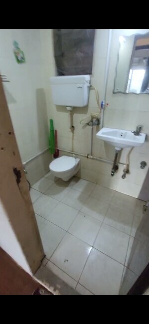Bathroom in 3 BHK Apartment at Ravi Group Gaurav woods 2, Mira Road – for Rent