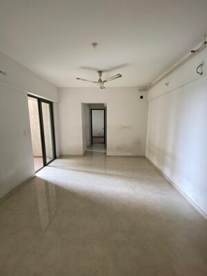 Living Room in 1 BHK Apartment at Lodha Palava Downtown, Dombivli East – for Sale