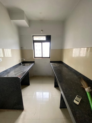 Kitchen in 1 BHK Apartment at Lodha Lakeshore Greens, Dombivli East – for Sale