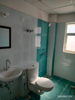 Bathroom in 2.5 BHK Apartment at Unique Sapphire, Mohanpura – for Rent