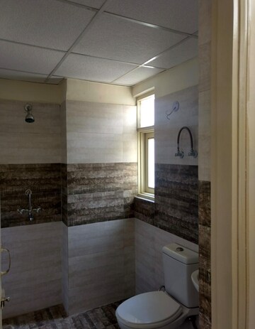 Bathroom in 3 BHK Apartment at SVP Gulmohur Garden Phase 2, Raj Nagar Extension – for Rent