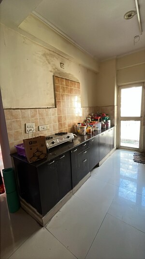 Kitchen in 3 BHK Apartment at Amrapali Silicon City, Sector 76 – for Rent