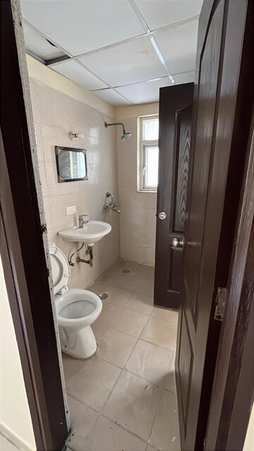 Bathroom in 3 BHK Apartment at Amrapali Silicon City, Sector 76 – for Rent