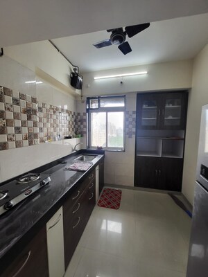 Kitchen in 1 BHK Apartment at Sahil Pride Residency Daffodil, Kasarvadavali – for Sale