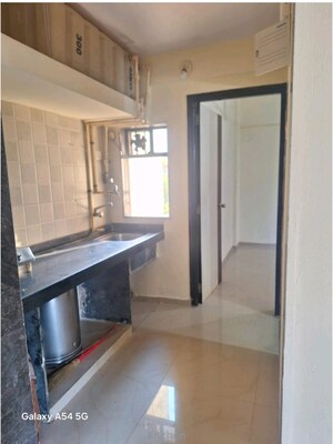 Kitchen in 1 BHK Apartment at Gala Lifestyle Pride Residency, Kasarvadavali – for Rent