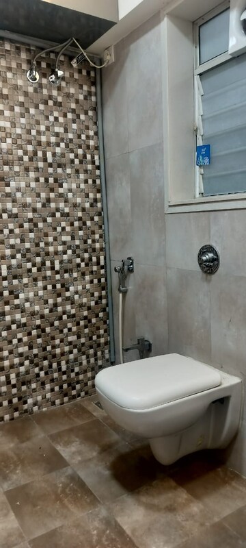Bathroom in 2 BHK Apartment at Model Town, Andheri West – for Rent