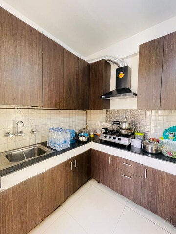 Kitchen in 2.5 BHK Apartment at Nirala Aspire, Panchsheel Green – for Rent