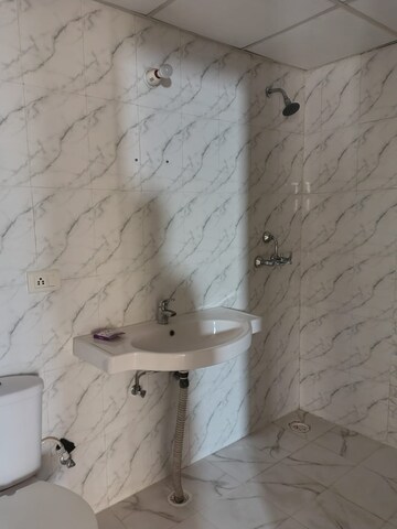 Bathroom in 2 BHK Apartment at Charms Castle Phase II, Raj Nagar Extension – for Rent