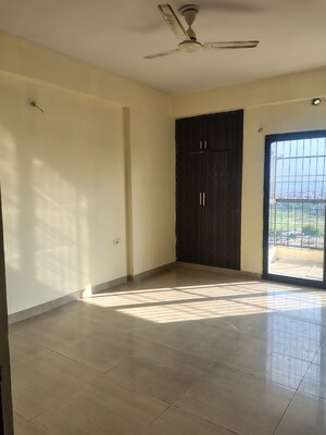 Room in 2 BHK Apartment at Charms Castle Phase II, Raj Nagar Extension – for Rent