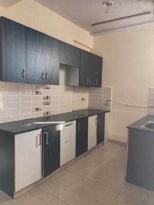 Kitchen in 2 BHK Apartment at Charms Castle Phase II, Raj Nagar Extension – for Rent