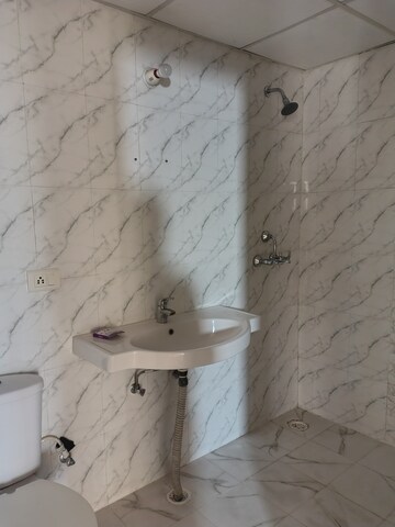 Bathroom in 2 BHK Apartment at Charms Castle Phase II, Raj Nagar Extension – for Rent