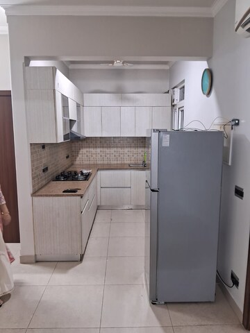 Kitchen in 3 BHK Builder Floor at Central Park Flower Valley Aqua Front Towers, Sohna Sector 33 – for Rent