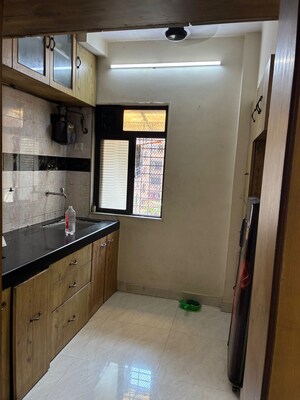Kitchen in 2 BHK Apartment at Om Manusmruti  CHS, Thane West – for Rent