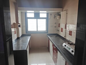 Kitchen in 2 BHK Apartment at Kanakia Spaces Niharika, Manpada – for Rent