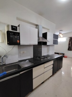 Kitchen in 2 BHK Apartment at Jhamtani Ace Almighty Phase I, Wakad – for Rent