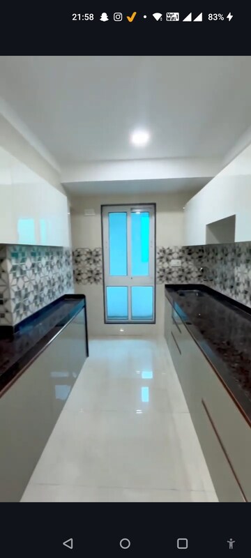 Kitchen in 2 BHK Apartment at Relliance Lashkaria Solitaire, Andheri West – for Sale