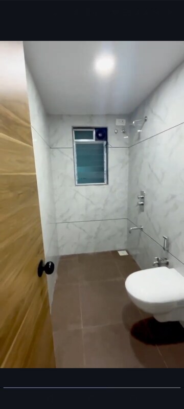 Bathroom in 2 BHK Apartment at Relliance Lashkaria Solitaire, Andheri West – for Sale