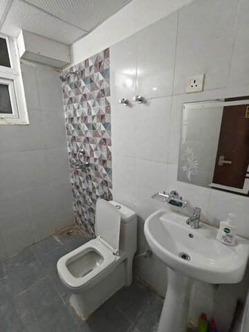 Bathroom in 3 BHK Apartment at Urban Axis Urban Woods, Sushant Golf City – for Rent