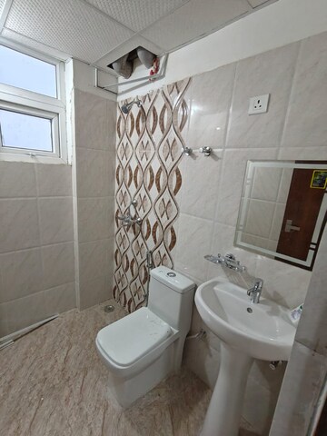 Bathroom in 3 BHK Apartment at Urban Axis Urban Woods, Sushant Golf City – for Rent