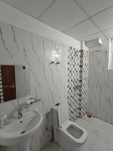 Bathroom in 3 BHK Apartment at Urban Axis Urban Woods, Sushant Golf City – for Rent